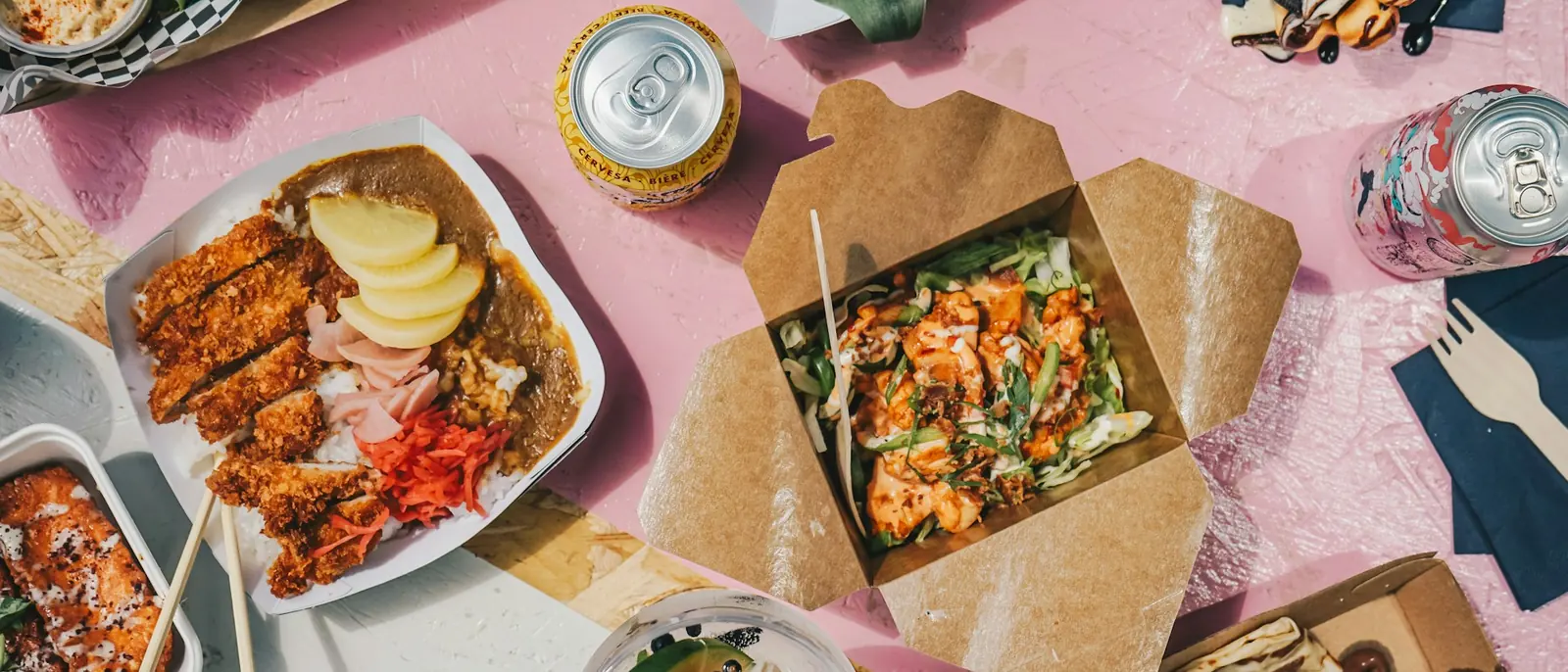 Takeaway meals in kraft boxes on a table